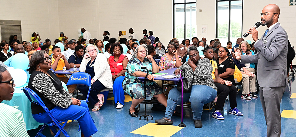 Superintendent John Pace speaking a community meeting